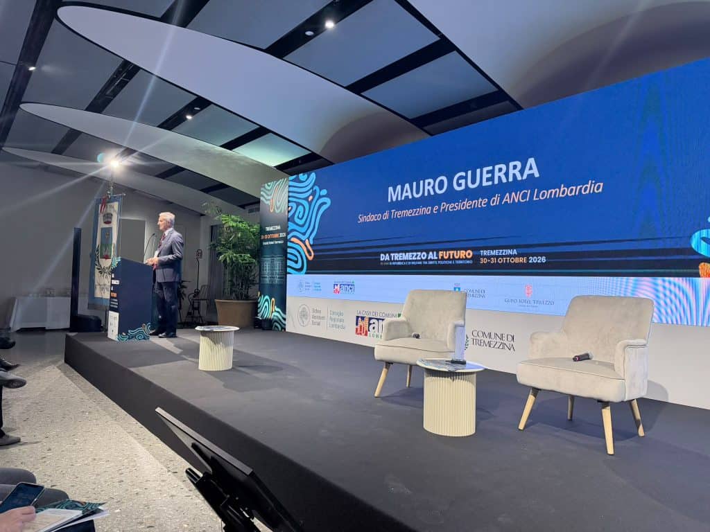 Speaker Mauro Guerra on stage during the Anci Lazio event in Tremezzo, a conference on republican welfare issues and the future of the region.